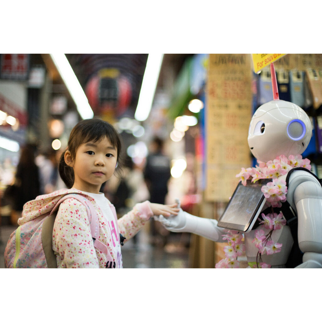 Bambina e robot digitale_Foto di Andy Kelly su unsplash