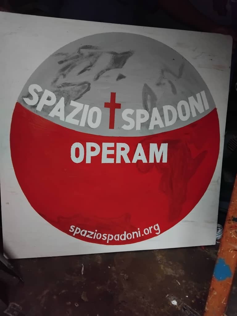 2026 avril 14 joint effort ouganda foulard plaque spazio + spadoni œuvres de miséricorde operam 7